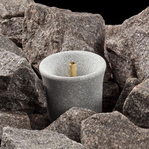 Hukka-Sisukas-Sauna-Fountain-Essence-Diffuser-on-stones